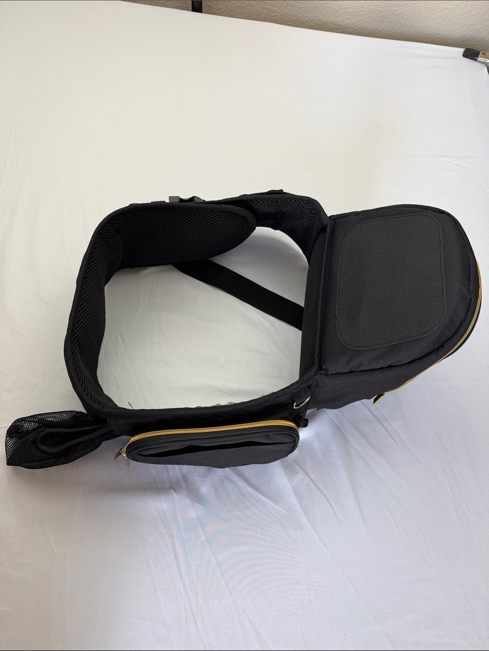 Tushbaby ergonomic hip carrier in black with gold hardware. Adjustable - Picture 2 of 9